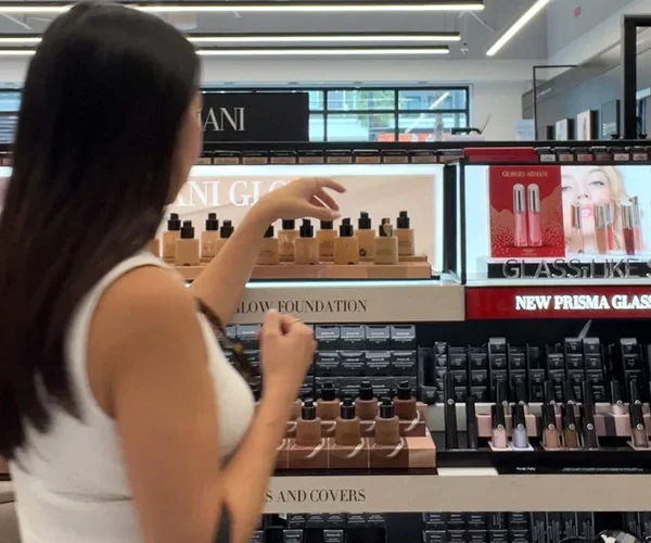 Flat lay of Sephora sale makeup products on marble surface