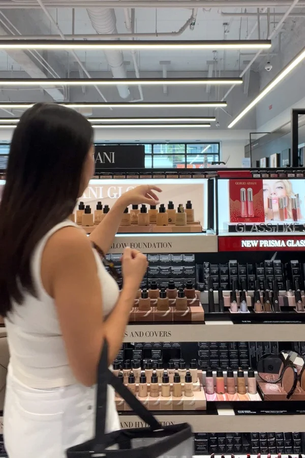 Flat lay of Sephora sale makeup products on marble surface