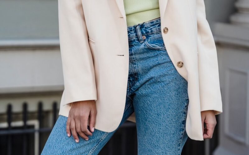 Woman wearing casually elevated knit top with neutral fall palette
