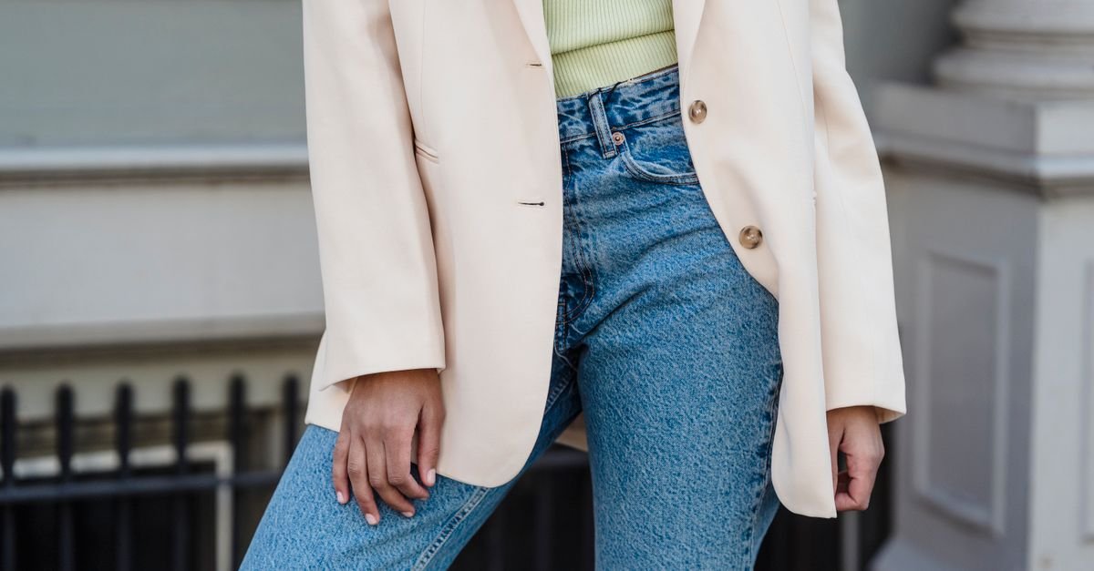 Woman wearing casually elevated knit top with neutral fall palette