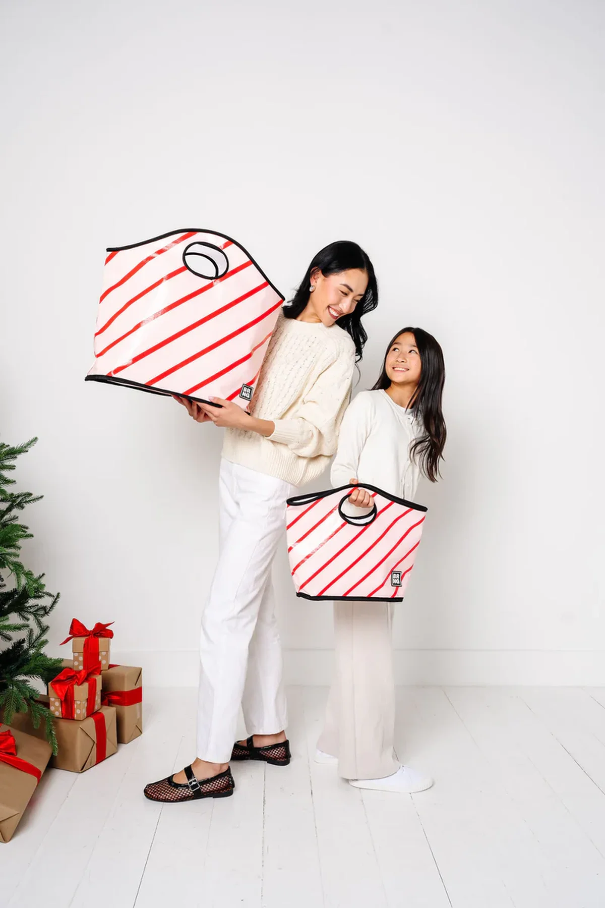 Child modeling mini BRNG tote bag size