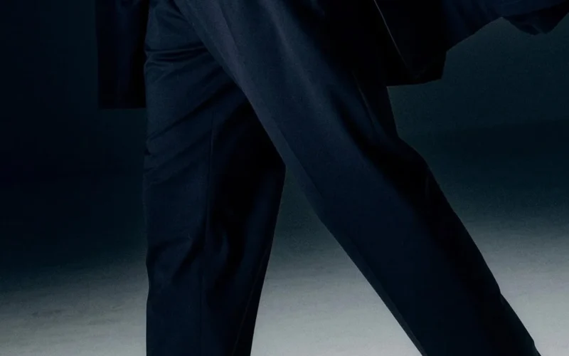 Full-length look in tailored trousers and loafers
