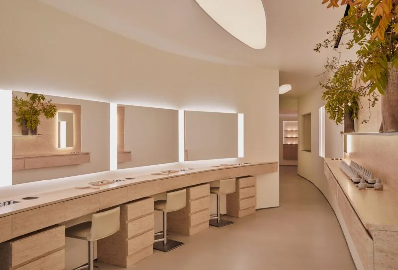 Modern bathroom vanity with mirrors and green plants