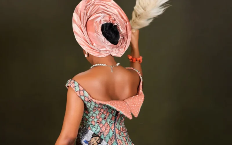 Kiky Faminu in a peach gele and patchwork wedding gown