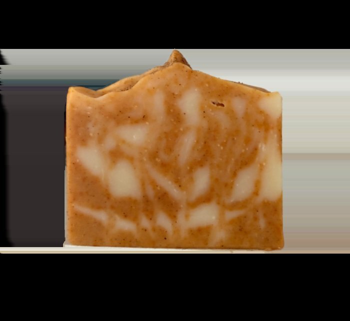 Harvest Cider soap in warm orange tones, finished with a dusting of cinnamon