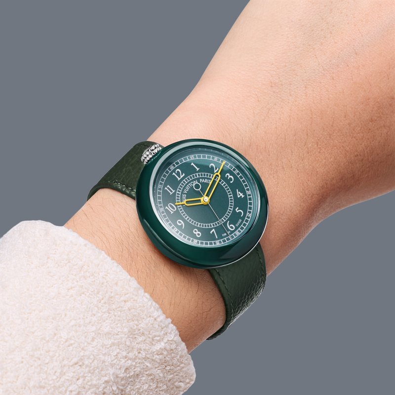 Green ceramic Monterey worn on a wrist with a knit sleeve